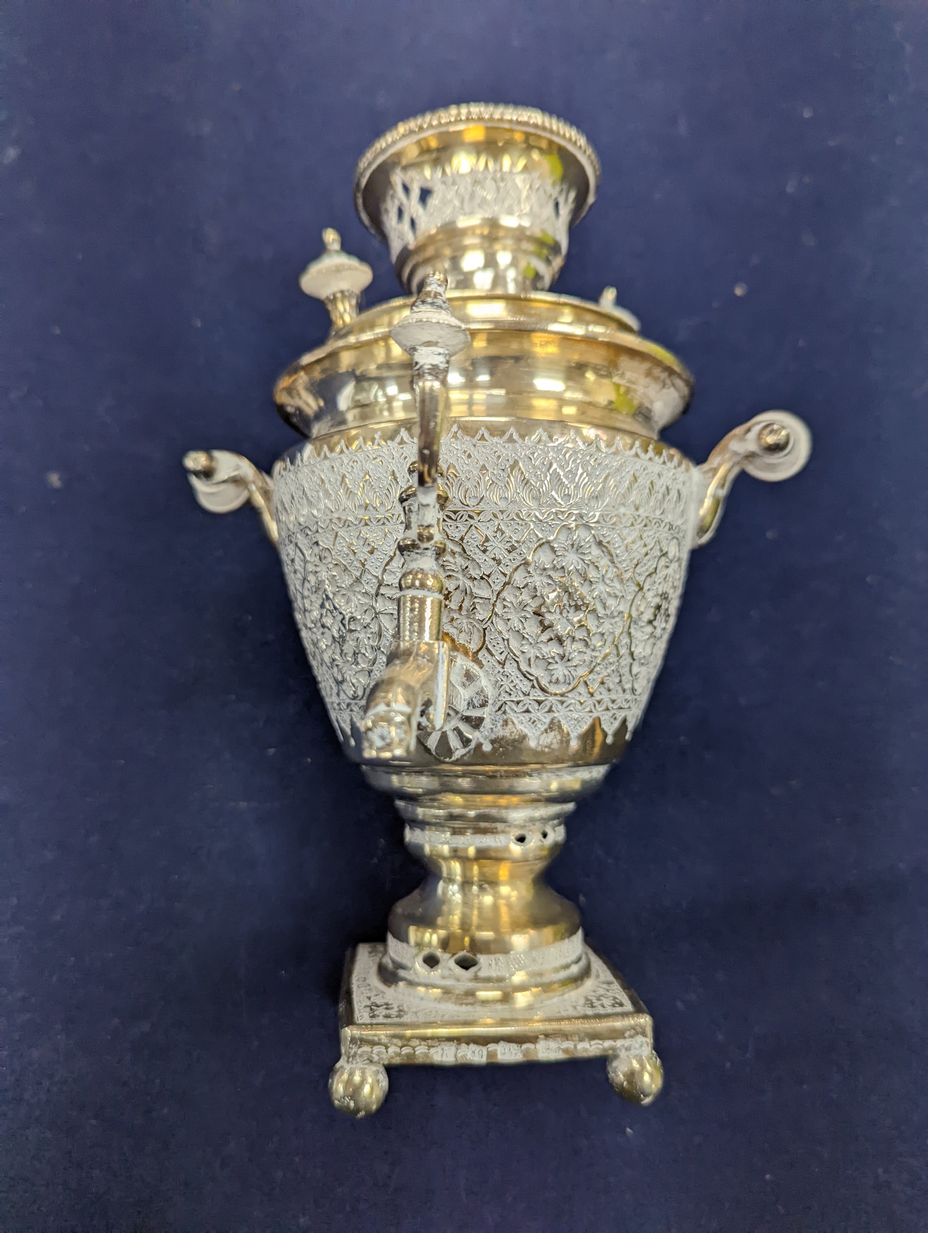 A set of six Persian embossed 84 standard white metal coffee cup holders and matching sugar bowl and cover by Vartan and four other Persian white metal items.